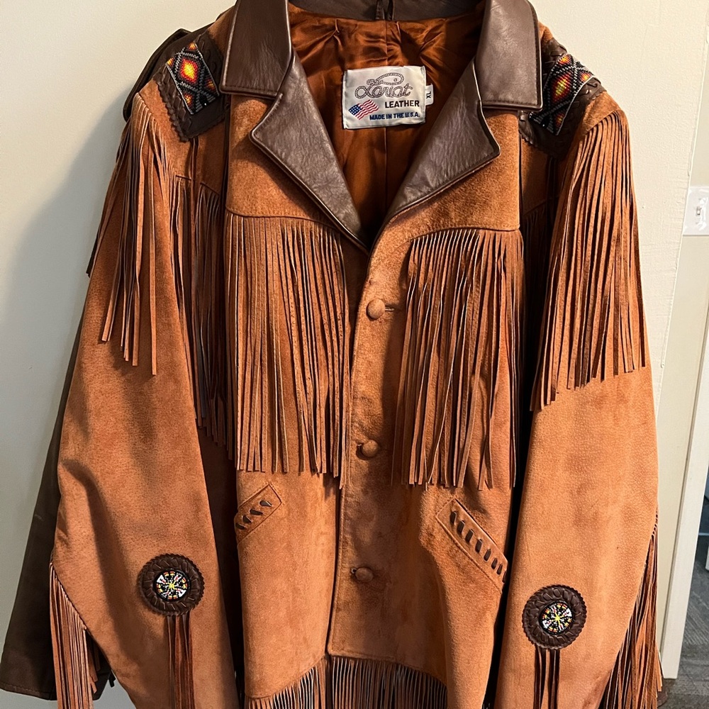 Lariat Brown Jacket pretty much brand new!Worn couple times. In closet covered